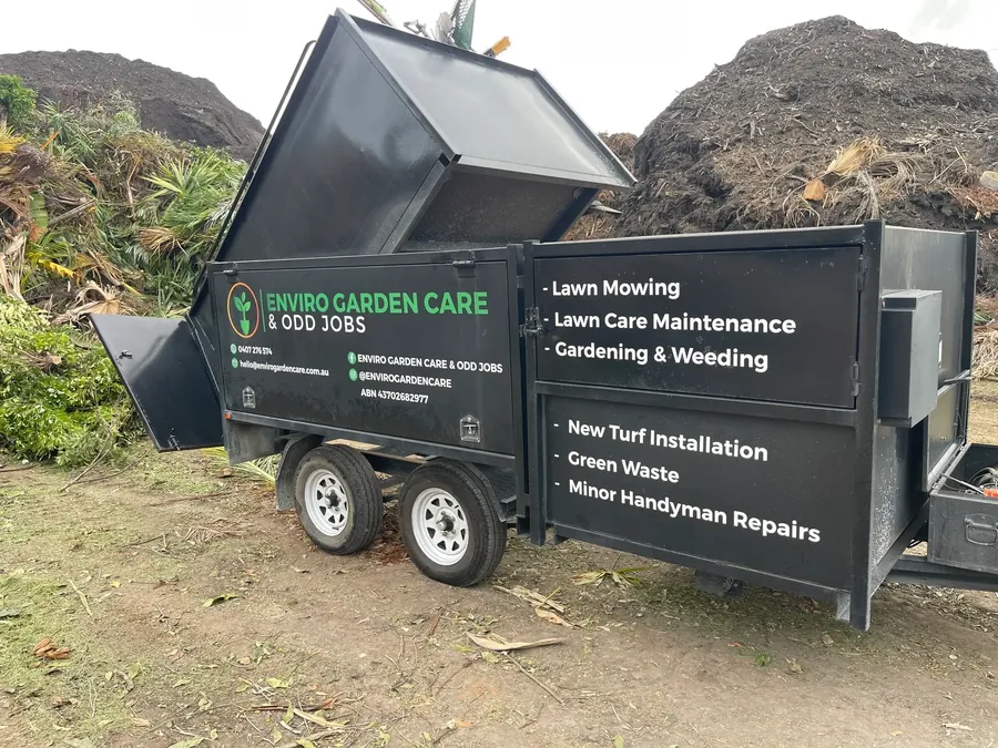 Enviro Garden Care trailer tipping green waste at the facility — green waste removal Gold Coast